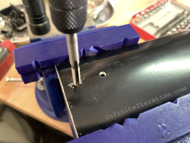 Tapping new holes in cross-bar