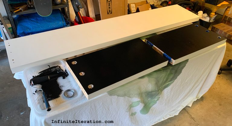White table pieces being painted black